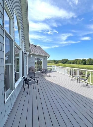 Dramatic views of rolling hills, trees, pond, and golf course from expansive deck on back of home