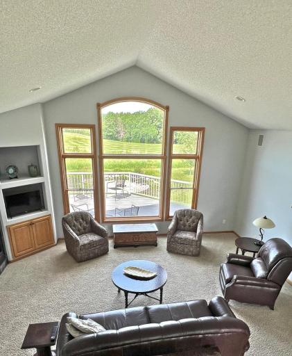 Another view of golf course setting through oversized great room windows