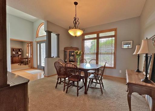 View of vaulted entry foyer through formal dining room