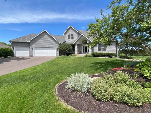 Additional view of front of custom built home w/perennial gardens
