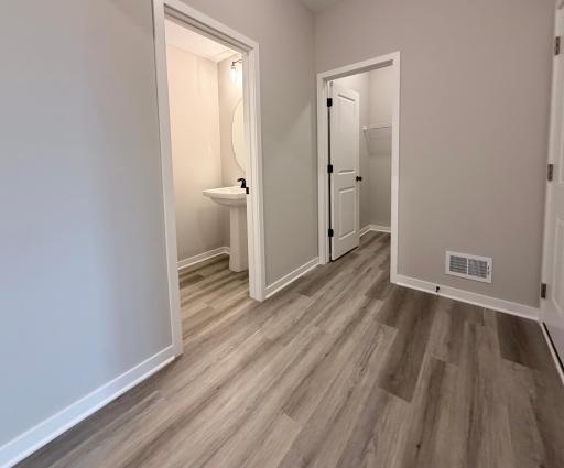 9686 32nd St NE- Mudroom features a Walk-in Closet and Half Bath.