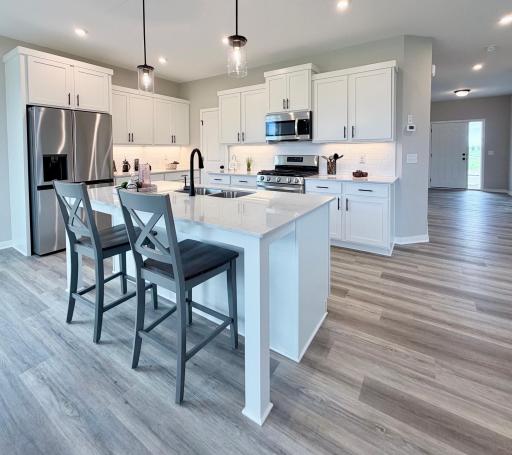 9686 32nd St NE- Kitchen features a spacious center island and walk-in pantry.