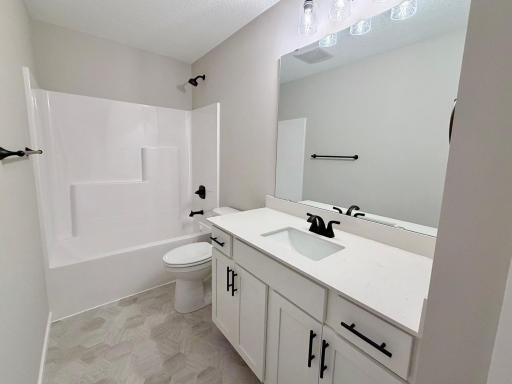 9868 32nd St NE- Upper Level Main Bath features Soft Close Cabinet Doors & Drawers