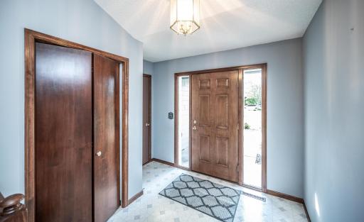 Covered front walkway leads to this spacious entryway with a convenient garage entrance (just steps from the kitchen) and a large entry closet.