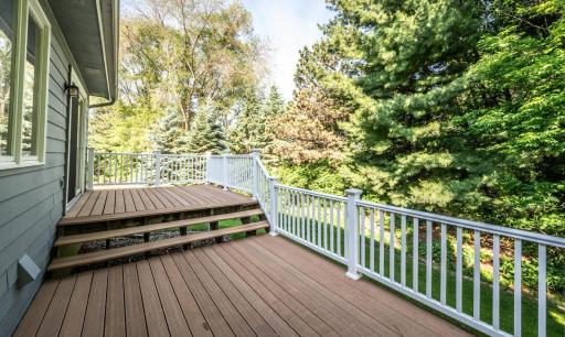 Maintenance free deck system overlooks the gorgeous perennial gardens in the backyard.