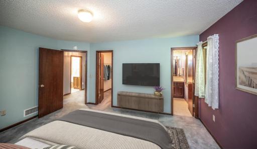 Virtually stages Primary bedroom on the upper level features a large walk-in closet and a private 3/4 bath.