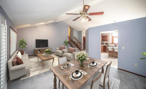 Virtually staged dining and living room with some separation to the kitchen but still open to it.