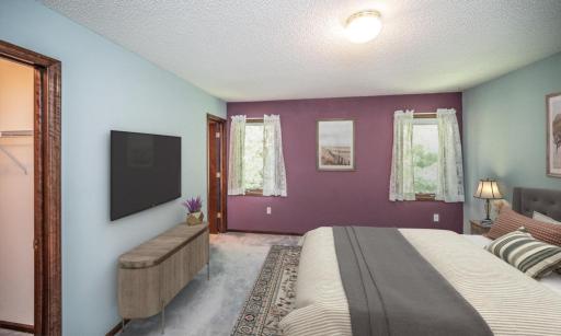 Virtually staged alternate view of the primary bedroom.