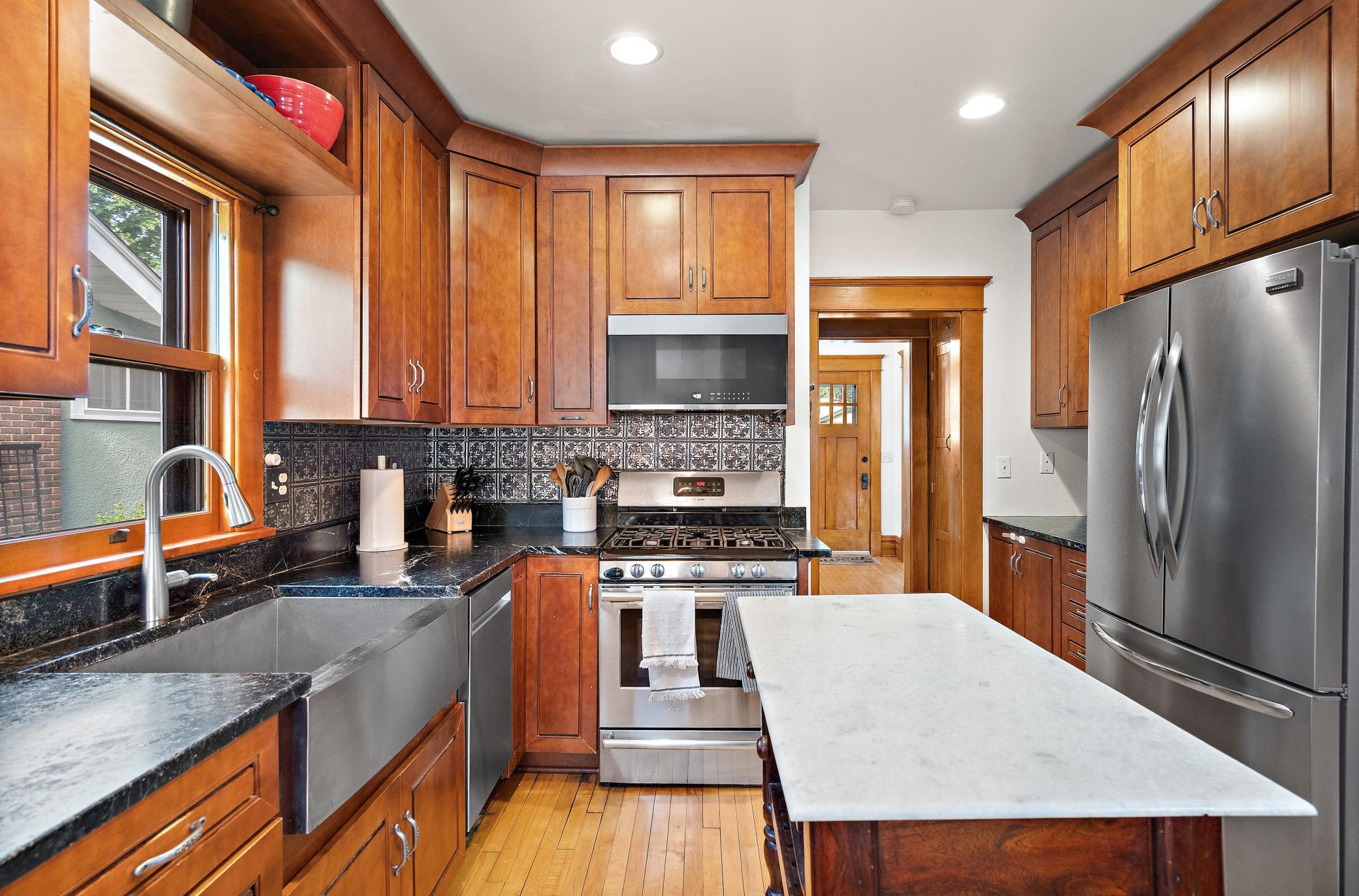 Granite, stainless steel and plenty of storage in the kitchen