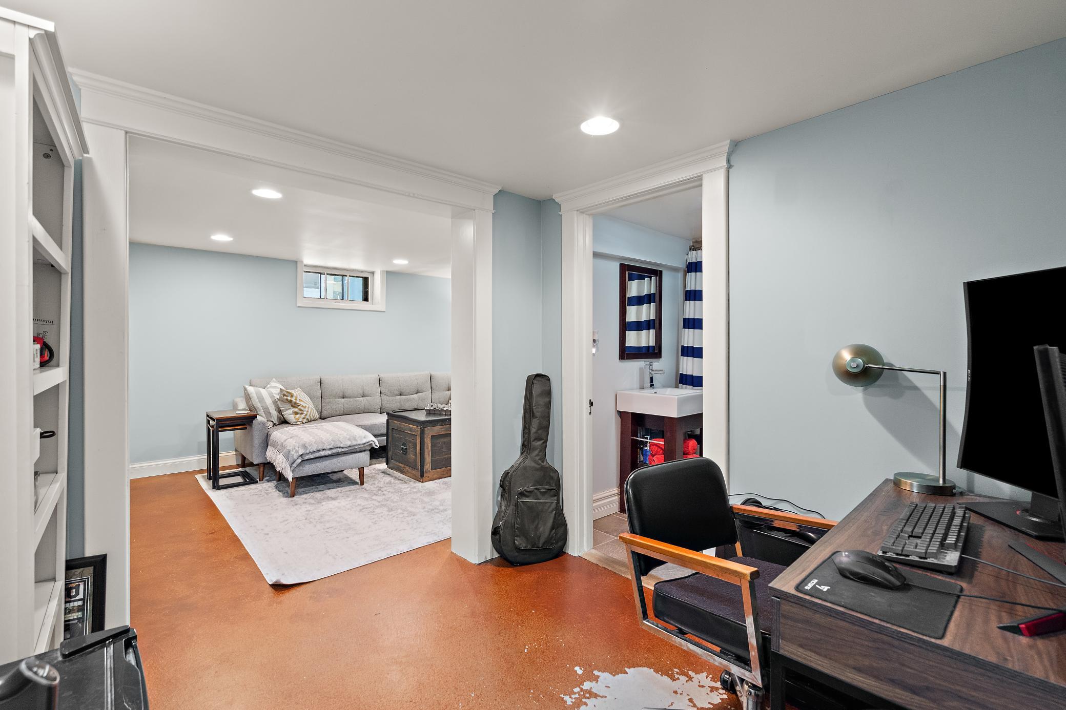 Lower level landing area provides versatile options