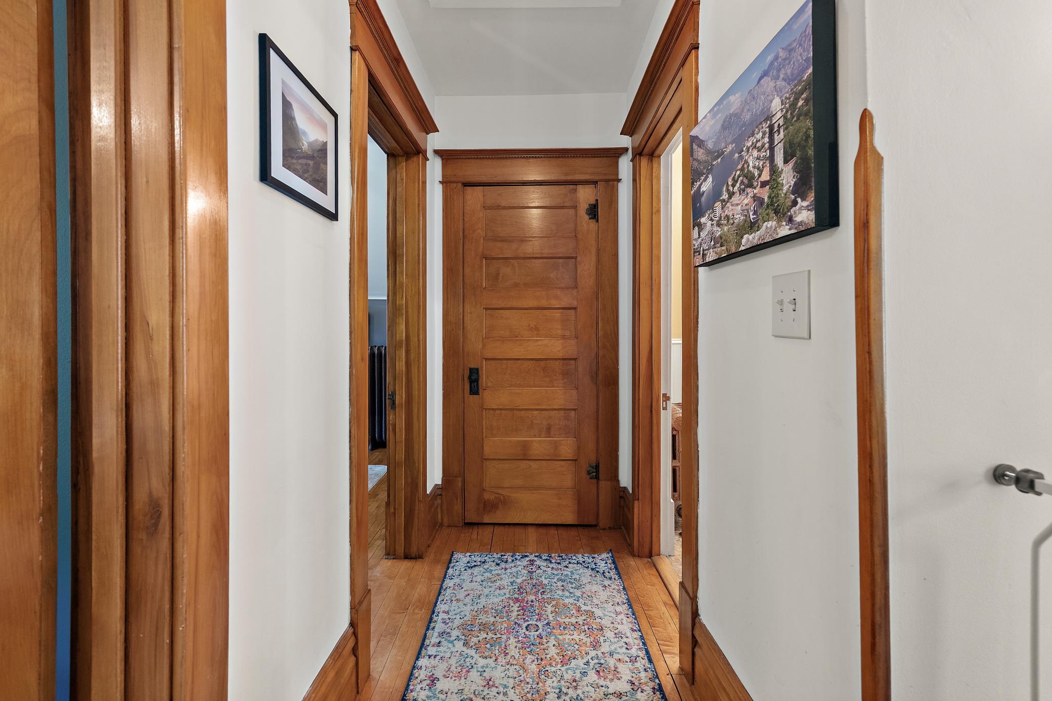 The natural wood continues upstairs