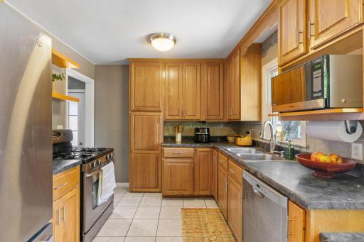 Kitchen with ceramic tile, SS appliances, and upgraded cabinets
