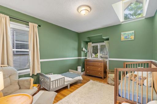 Main level bedroom with an extra window up for light