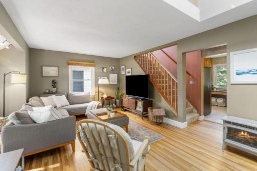 Reverse view into the kitchen and the stairs sightline. Above is the upstairs skylight window that brings extra sunlight into the home