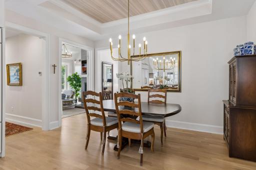 The dining room is open to the kitchen as well and features a tray vault ceiling.
