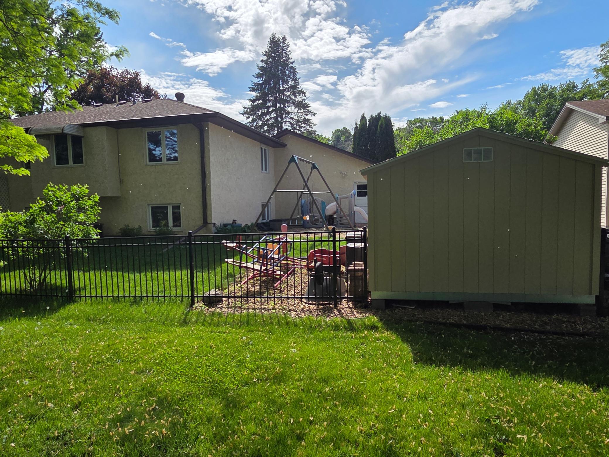 Large Shed Included with Park Like Play Ground Equipment