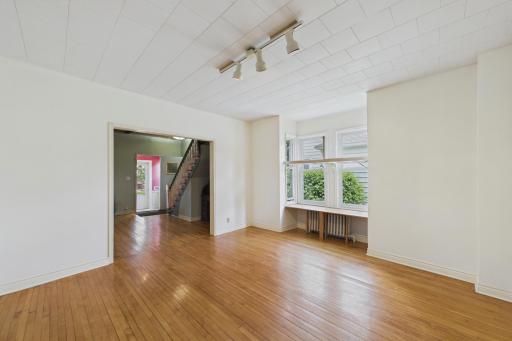 Oversized bonus room on the main level ideal for a family room, playroom, office, hobby space, or entertainment area.