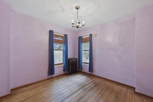 Convenient main-level bedroom with flexible use as a guest room, office, or primary bedroom option.