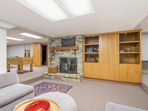 Wood burning fireplace and custom cabinets.