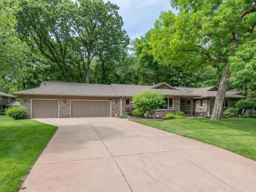 Concrete driveway, 3 car garage with epoxy floors.