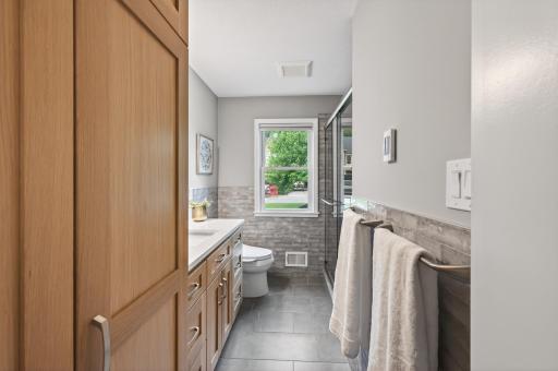 Heated floors and washer and dryer in cabinet