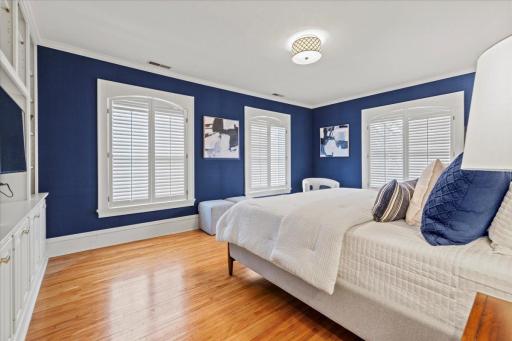Expansive primary suite with a connected bathroom and a large walk-in closet with its own separate exit