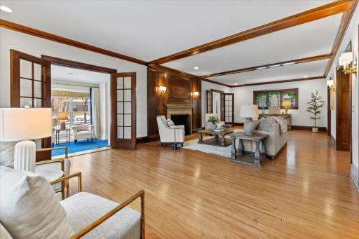 Luxurious living room featuring rich mahogany woodwork, creating an inviting yet elevated atmosphere