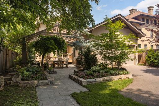 The exquisite landscaping is carried throughout the lot into the backyard.
