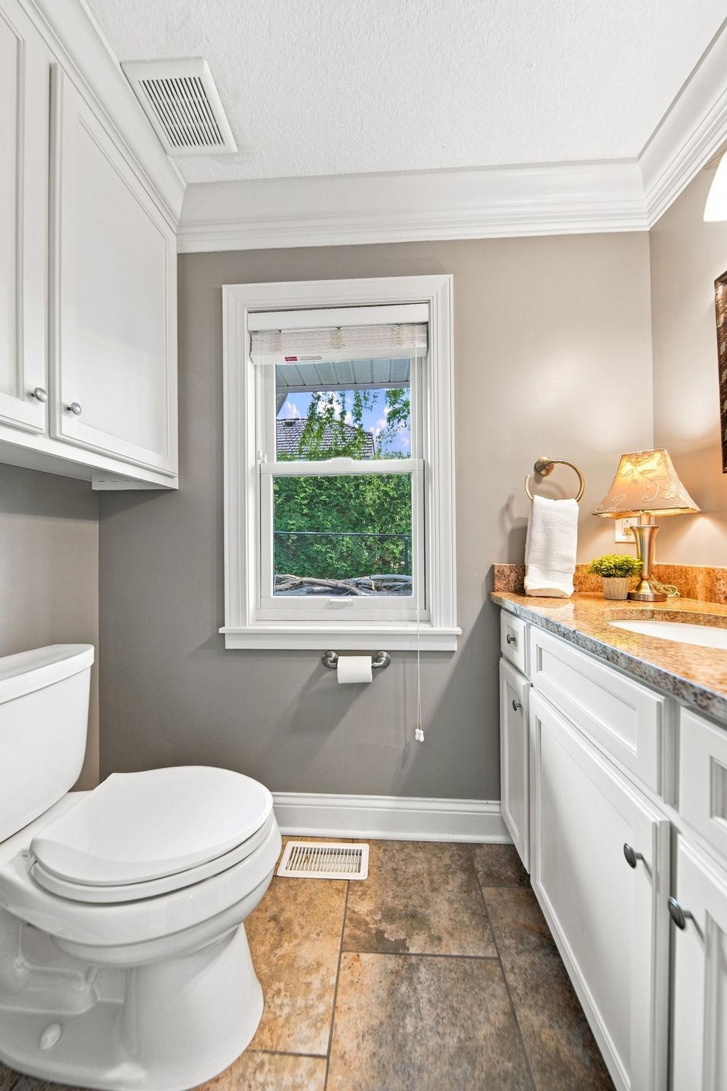 Main level half bath off laundry/kitchen