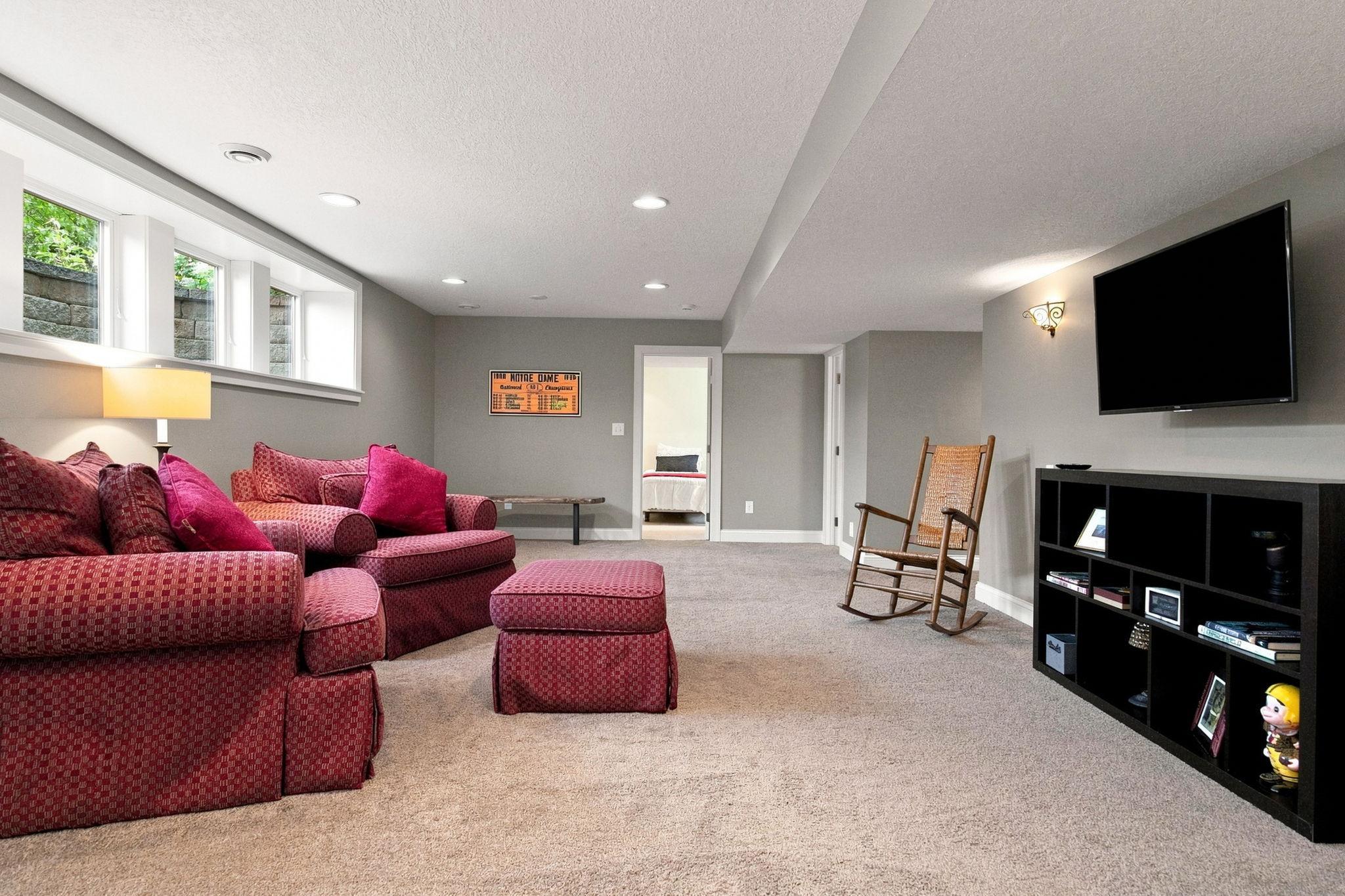 Lower level recreation room with lookout windows