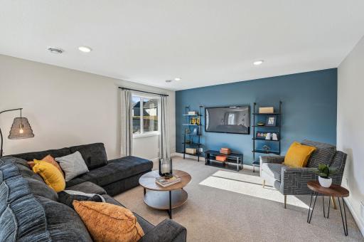 Lower Level Family Room - photo of a staged model home of the same floorplan. Selections may be different.