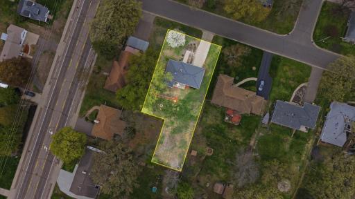 Very deep lot with fire-pit area and storage shed.