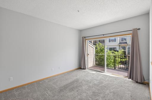 Living Room with Walkout to Maintenance Free Deck