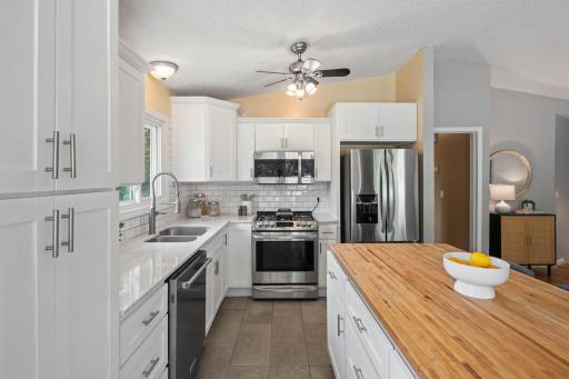 SS appliances and a bright kitchen window