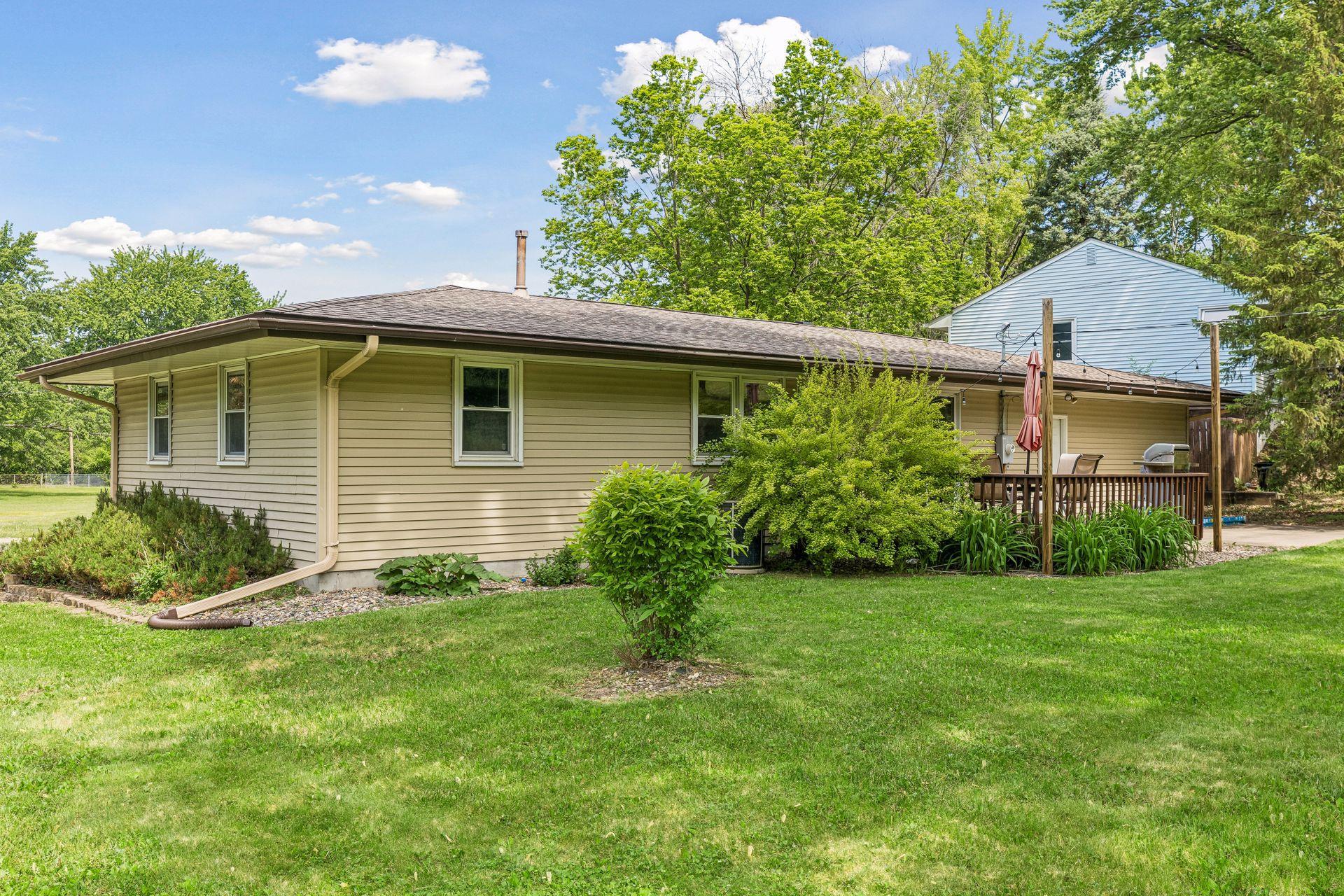 Rear of home with attached deck
