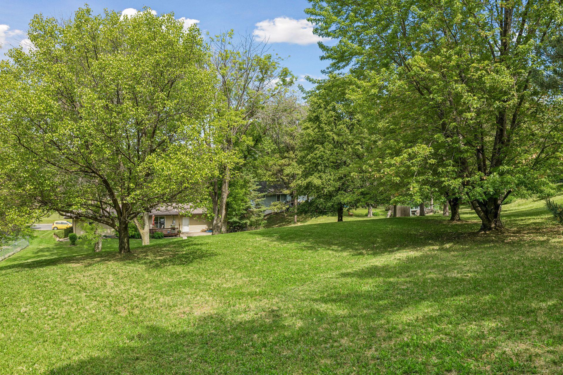 Incredible oversized lot and park-like backyard... with another park out front!