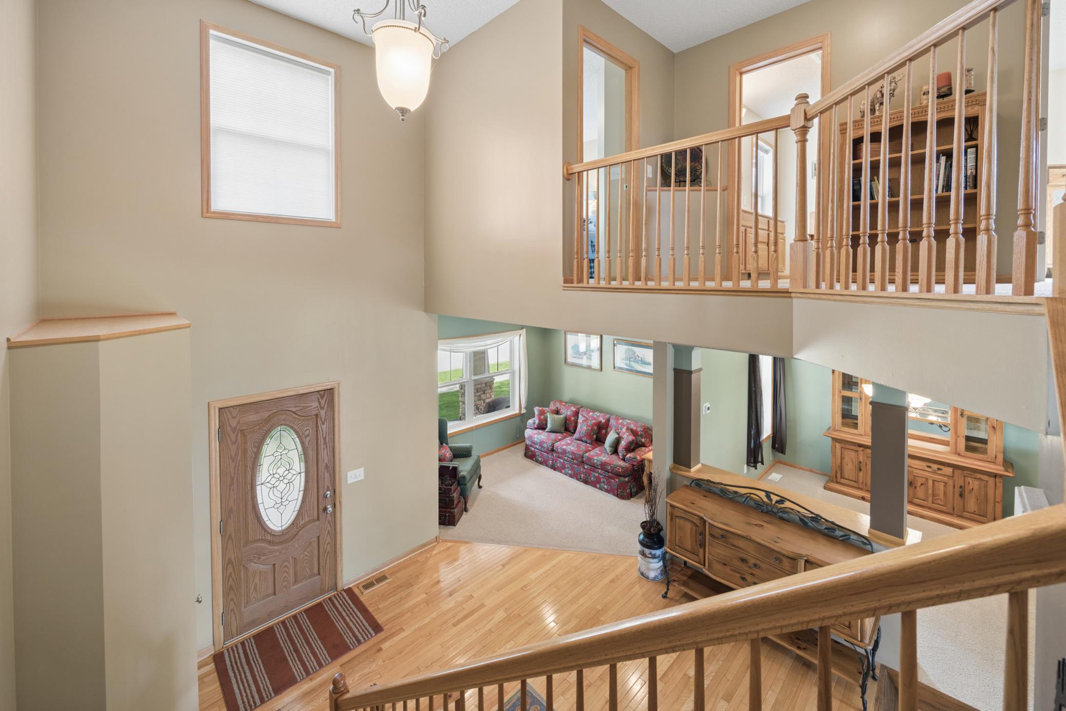 The soaring open foyer brings in great natural light
