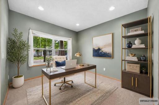 Front study/flex room imagined as a home office (Shown virtually staged)