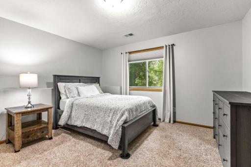 Spacious lower level bedroom.