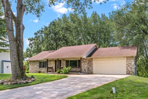 The low-maintenance brick front, established mature trees, and inviting front porch offer beautiful curb appeal from the moment you arrive. Concrete driveway.