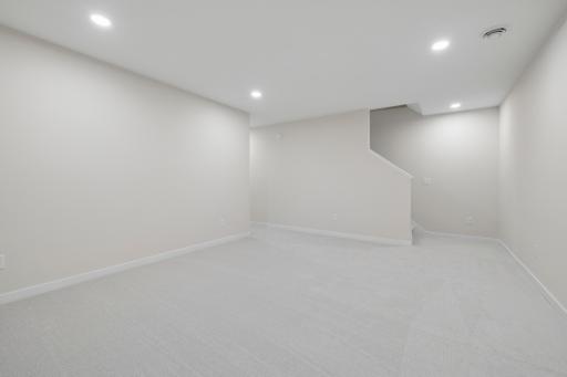 The finished lower level is an expanded entertaining space with family room, 4th bedroom and additional bathroom.