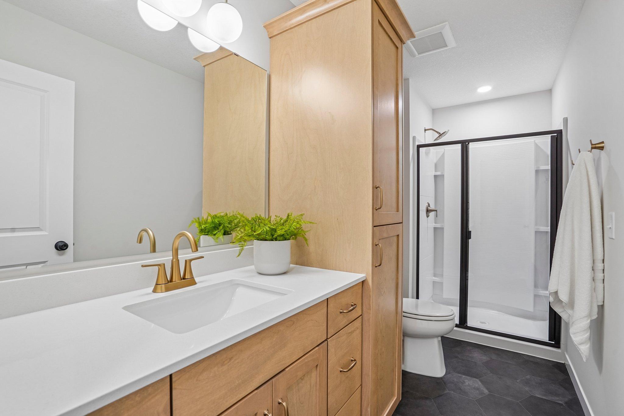 Secondary Bathroom with endless storage.