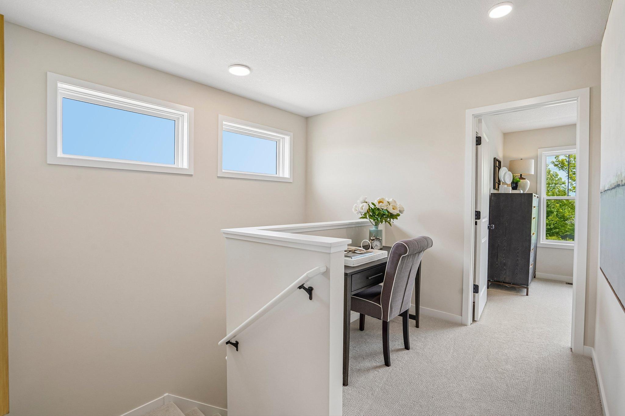 Functional upper level with room for a desk or reading nook, 3 spacious bedrooms, two well-appointed bathrooms and convenient laundry with built-in cabinetry.