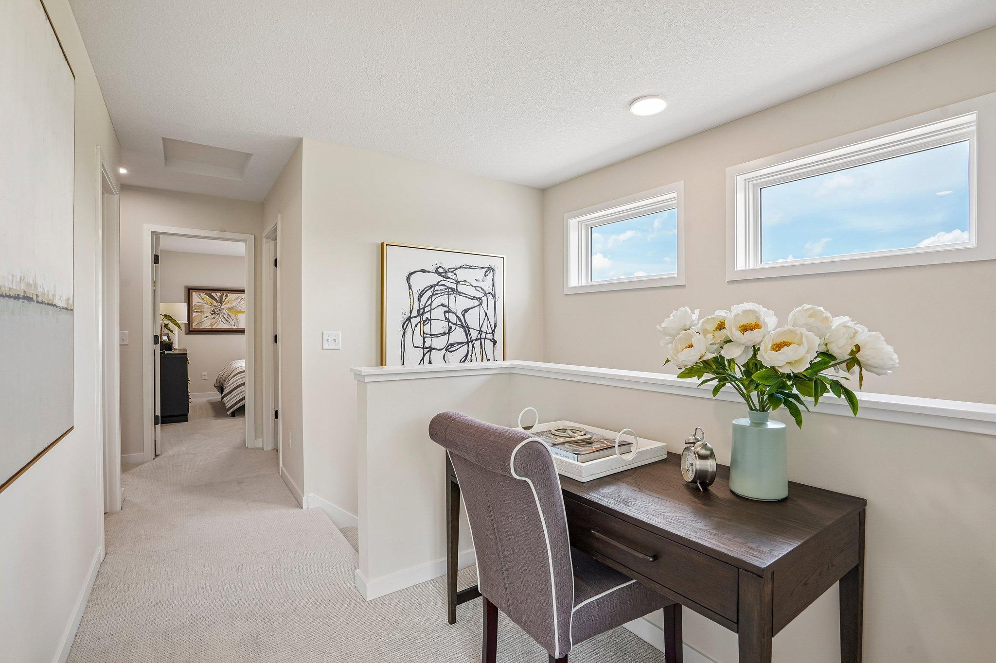 Functional upper level with room for a desk or reading nook, 3 spacious bedrooms, two well-appointed bathrooms and convenient laundry with built-in cabinetry.
