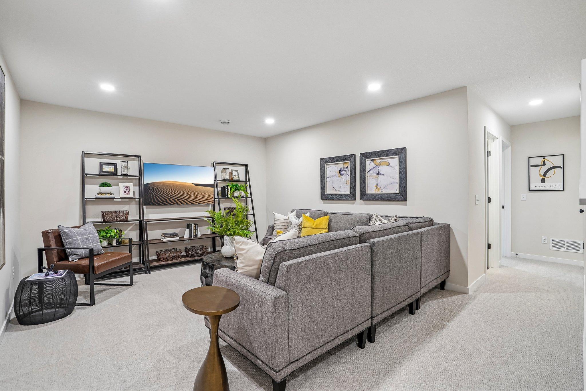 The finished lower level is an expanded entertaining space with family room, 4th bedroom and additional bathroom.