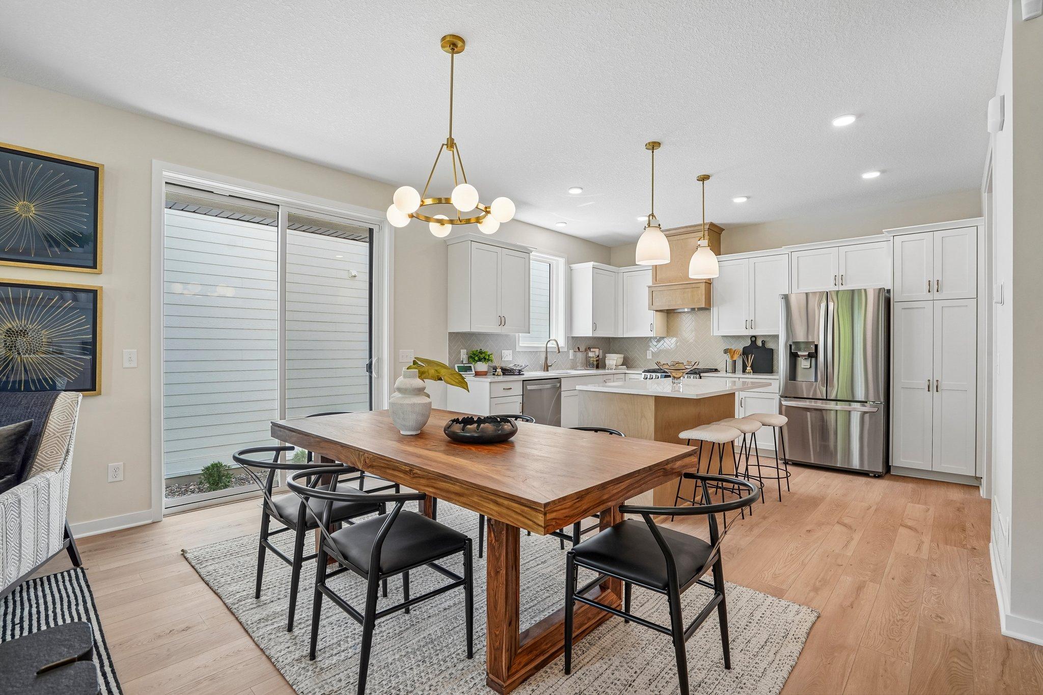 Dining walks out to patio and private side yard with fence.