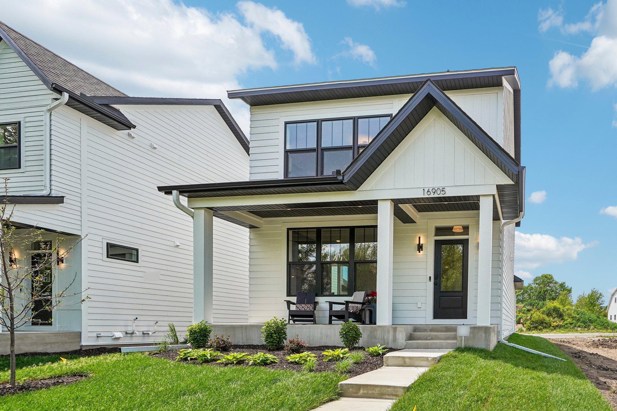 Modern farmhouse design combined with coveted maintenance free lifestyle.