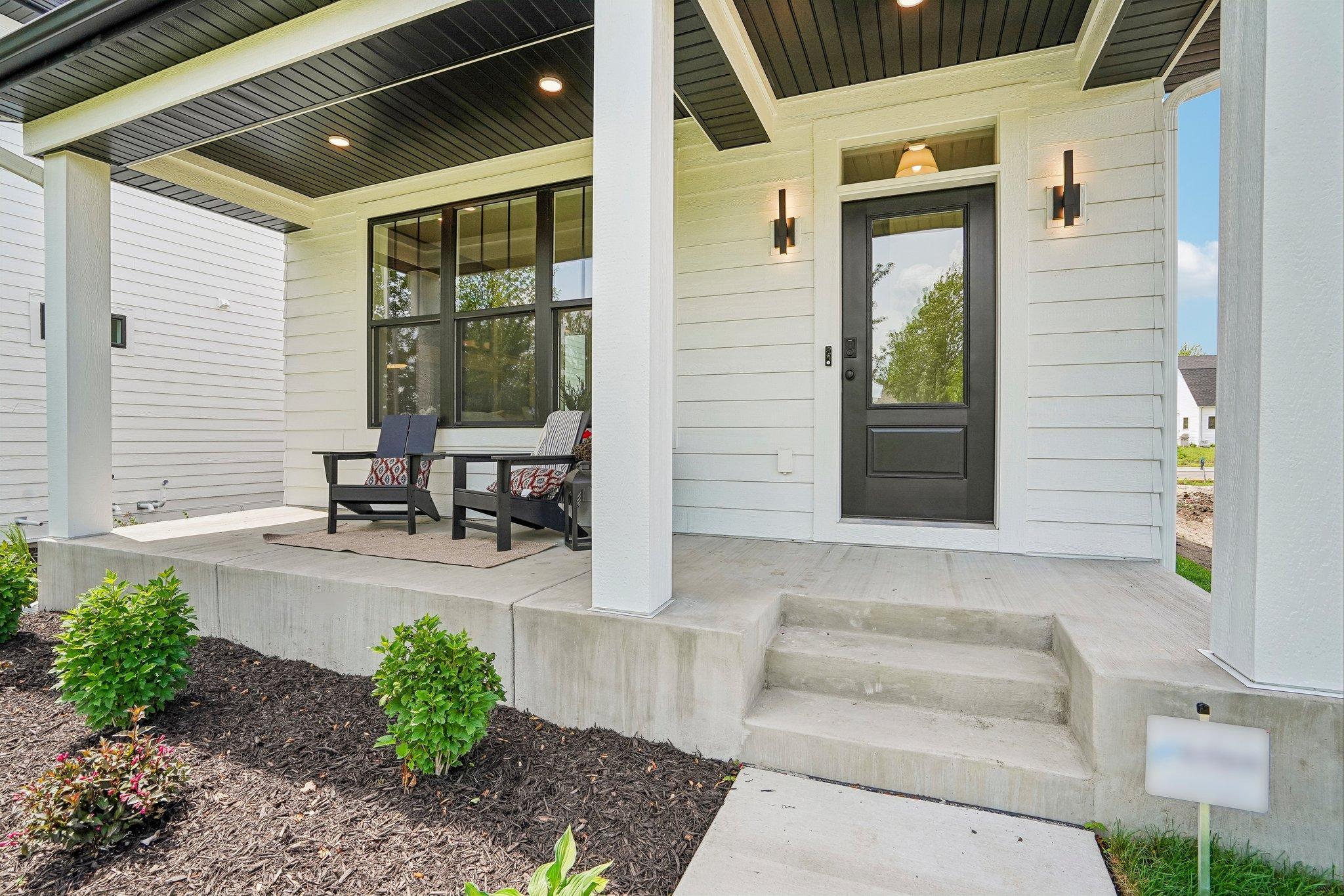 Gorgeous front porch, a great space to enjoy a morning coffee!