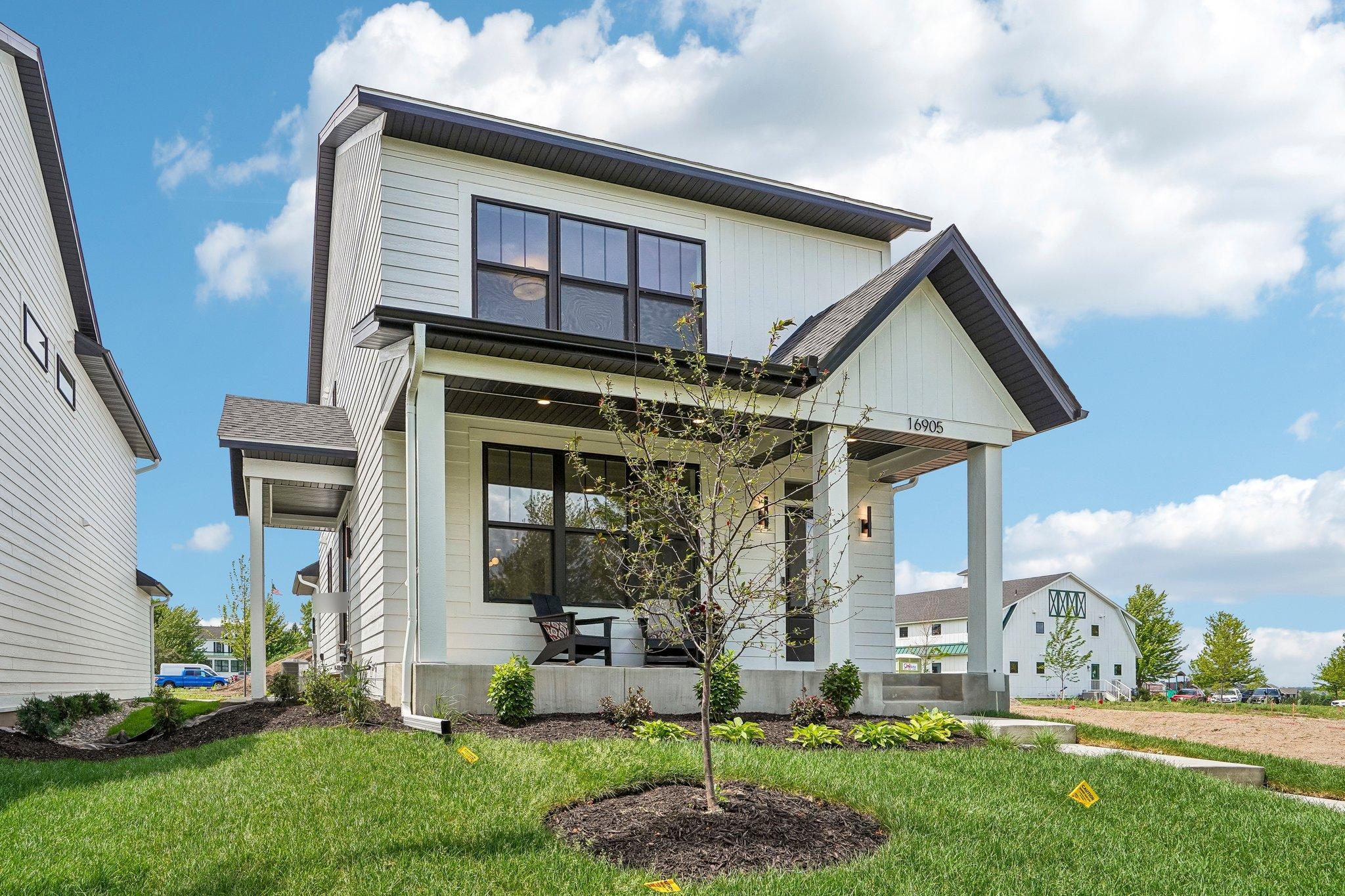 Modern farmhouse design combined with coveted maintenance free lifestyle.