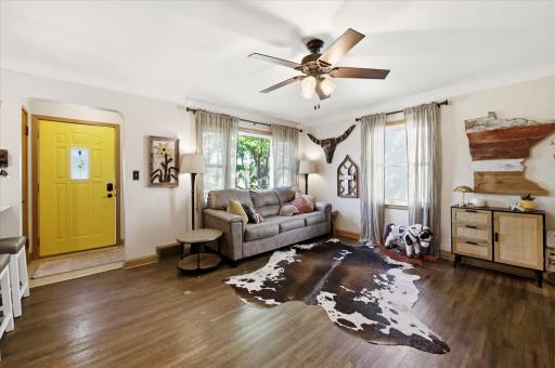 Charming living space with coved ceilings and original hardwood floors.